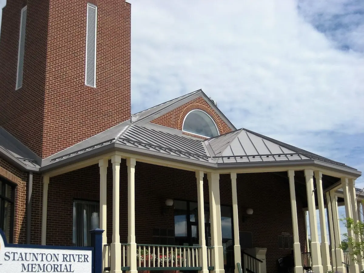 Skilled roofing craftsmen working on a residential roof in Milton